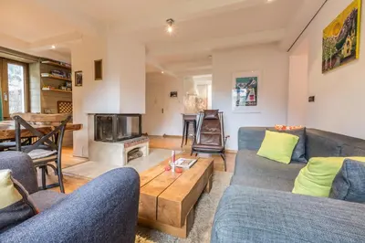 a living room with two blue couches and a table at Apartment Germain Close to Chamonix Mont Blanc in Chamonix-Mont-Blanc
