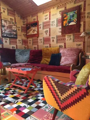 a living room with a couch and a table at chalet des petits loups in Chamonix-Mont-Blanc