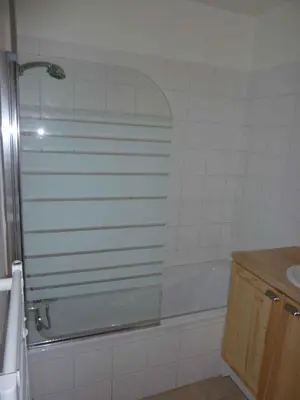 a bathroom with a shower and a tub and a sink at Le Hameau des Neiges in Demi-Quartier