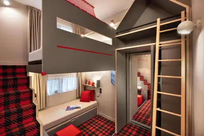 a kids room with a bunk bed and a staircase at RockyPop Chamonix - Les Houches in Les Houches