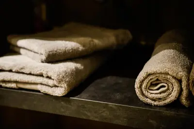 a pile of towels sitting on top of a counter at La Chabane in Chamonix-Mont-Blanc