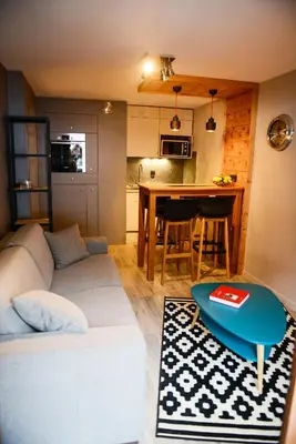 a living room with a couch and a table at La Chabane in Chamonix-Mont-Blanc