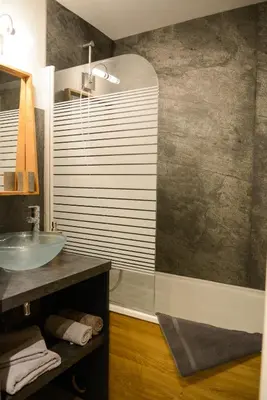 a bathroom with a sink and a mirror at La Chabane in Chamonix-Mont-Blanc