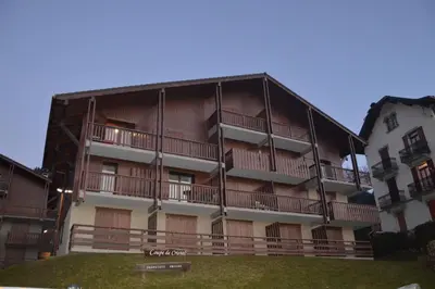 a large building with balconies on the side of it at La Coupe De Cristal in Saint-Gervais-les-Bains