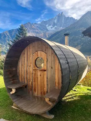 a small wooden hobbit house in the mountains at Marmotte Mountain Eco Lodge in Chamonix-Mont-Blanc