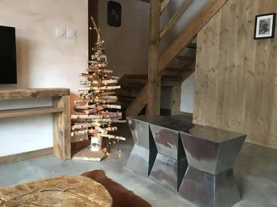 a christmas tree in the corner of a room at Les Chalets Aquarelle in Chamonix-Mont-Blanc