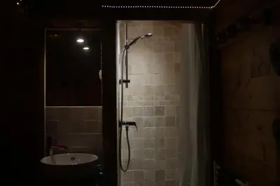 a bathroom with a shower with a sink and a shower at Chalet Alpine Rose in Chamonix-Mont-Blanc