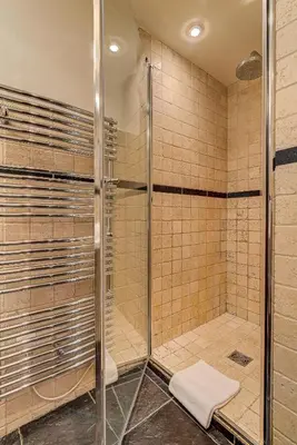 a shower with a glass door in a bathroom at APARTMENT LES DRUS - Alpes Travel - Chamonix - Sleeps 6 in Chamonix-Mont-Blanc
