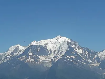 a mountain covered in snow on a clear day at appart st gervais le Topaze in Saint-Gervais-les-Bains