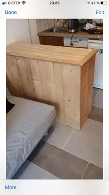 a wooden counter in a kitchen with a mattress under it at Apartment Clos du Savoy in Chamonix-Mont-Blanc