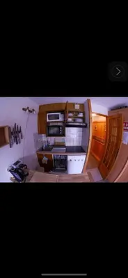 a small room with a desk in a boat at Apartment Clos du Savoy in Chamonix-Mont-Blanc