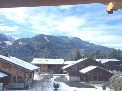 a group of buildings with snow on the roofs at Chalet spacieux à Samoëns de 210 m² avec jacuzzi et jardin in Samoëns