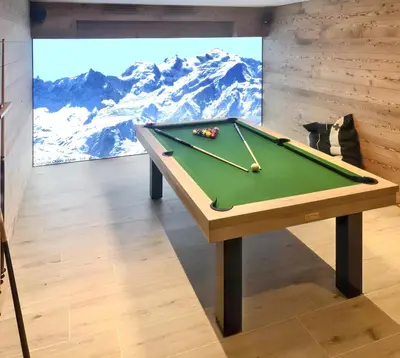 a pool table in a room with a painting at Chalet spacieux à Samoëns de 210 m² avec jacuzzi et jardin in Samoëns