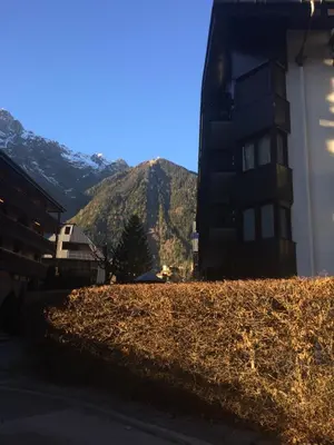 a view of a building with a mountain in the background at Studio Aoste in Chamonix-Mont-Blanc