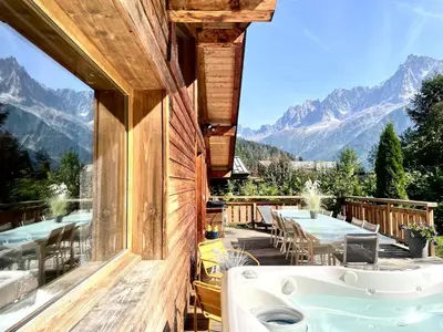 a kitchen and dining room with a table and chairs at Chalet 4C in Les Houches