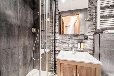 a bathroom with a sink and a shower at Eden Studio Chamonix Centre in Chamonix-Mont-Blanc