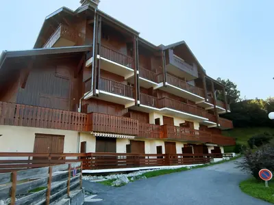 a table on a balcony with a view of mountains at Studio La pointe des Aravis 3 by Interhome in Saint-Gervais-les-Bains