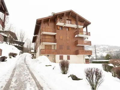 a building in the snow with a sign in front at Studio La pointe des Aravis 3 by Interhome in Saint-Gervais-les-Bains