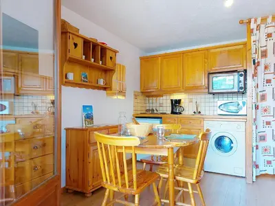 a kitchen with a microwave and a washing machine at Studio La pointe des Aravis 3 by Interhome in Saint-Gervais-les-Bains