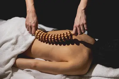 a woman laying on her back with a group of wooden bracelets at Hôtel Les Aiglons Chamonix in Chamonix-Mont-Blanc