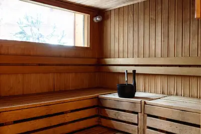 a cabin with a sauna with a window at Hôtel Les Aiglons Chamonix in Chamonix-Mont-Blanc
