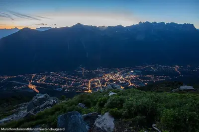 a view of a city at night from a mountain at La Grange De L'Aiguille in Chamonix-Mont-Blanc