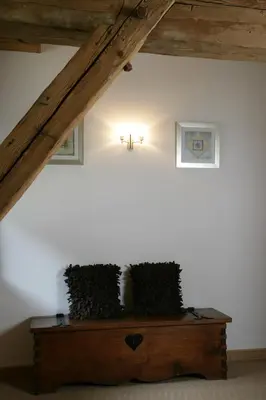a room with a wooden table with two plants on it at La Grange De L'Aiguille in Chamonix-Mont-Blanc