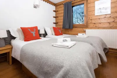 two beds sitting next to each other in a bedroom at Ginabelle 14 apartment - Chamonix All Year in Chamonix-Mont-Blanc