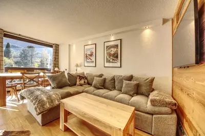 a living room with a couch and a table at Apartment Scott in Chamonix-Mont-Blanc
