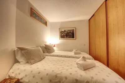 a bedroom with a bed with two stuffed animals on it at Apartment Scott in Chamonix-Mont-Blanc