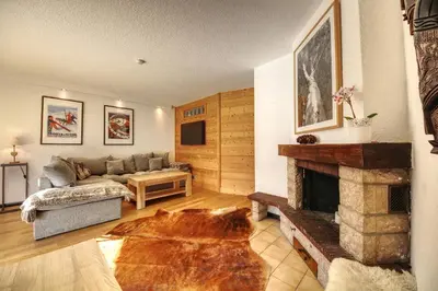 a living room with a couch and a fireplace at Apartment Scott in Chamonix-Mont-Blanc