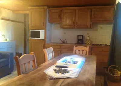 a kitchen with a table with a box on it at Appartement St Nicolas in Saint-Gervais-les-Bains