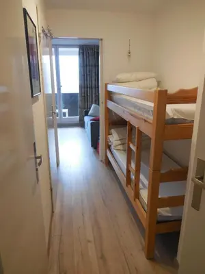 a room with two bunk beds and a hallway at SKI DORIS 310 Flaine Forêt in Flaine