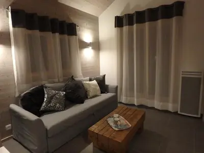 a living room with a couch and a coffee table at Chamonix IRIS in Chamonix-Mont-Blanc