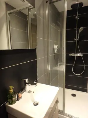 a bathroom with a shower and a sink and a shower at Chamonix IRIS in Chamonix-Mont-Blanc