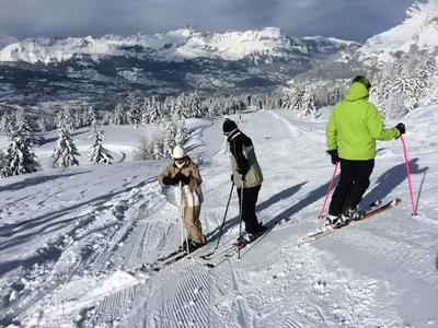 a group of three people on skis in the snow at Facing the Chamonix Needles in Les Houches