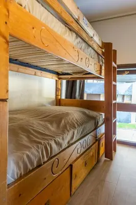 a couple of bunk beds in a room at Duplex Chamonix Les Grands Montets in Chamonix-Mont-Blanc