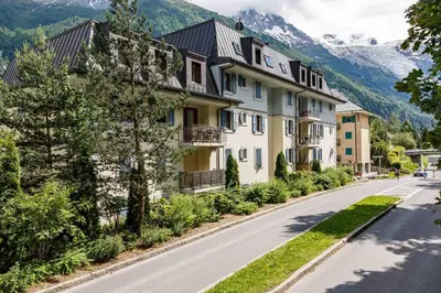 a building on the side of a road at Le Paradis 18 & 18b appts - Chamonix All Year in Chamonix-Mont-Blanc