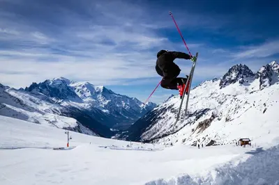 a person doing a trick on skis in the snow at Le Paradis 18 & 18b appts - Chamonix All Year in Chamonix-Mont-Blanc