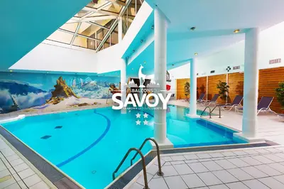 a large swimming pool with a sign that says spaasy at Les Balcons du Savoy in Chamonix-Mont-Blanc