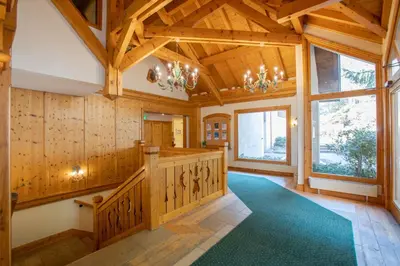 a large room with wooden walls and wooden beams at Les Balcons du Savoy in Chamonix-Mont-Blanc