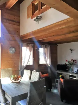 a dining room with a table and chairs at Chalet Clos Moccand in Samoëns