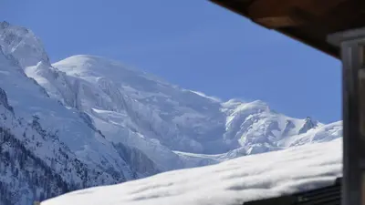 a view of a snow covered mountain from a train at LES 3 CIMES BLANCHES in Chamonix-Mont-Blanc