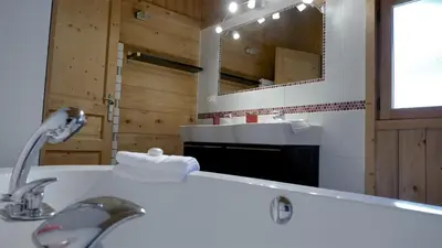 a bathroom with a sink and a mirror at LES 3 CIMES BLANCHES in Chamonix-Mont-Blanc