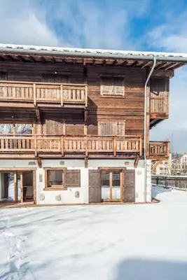 a wooden building with snow in front of it at Grand Paradis in Chamonix-Mont-Blanc