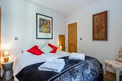 a bedroom with a bed with towels on it at Lodge aux Praz in Chamonix-Mont-Blanc