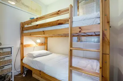 a bunk bed room with two bunk beds at Lodge aux Praz in Chamonix-Mont-Blanc
