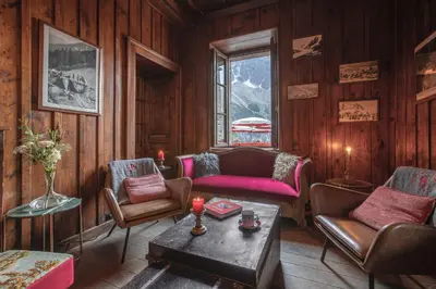 a living room with chairs and a table at Refuge du Montenvers in Chamonix-Mont-Blanc
