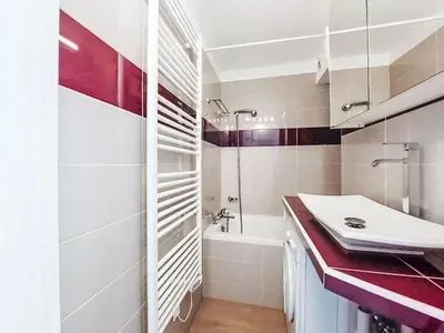 a white bathroom with a sink and a tub at Apartment Blanc Neige by Interhome in Chamonix-Mont-Blanc