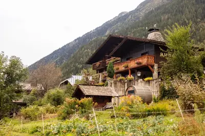 a building covered in snow in front at Auberge du Bois Prin in Chamonix-Mont-Blanc